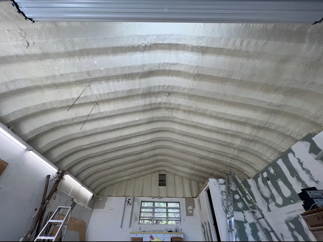 Spray polyurethane foam applied to the underside of a metal roof deck in McGregor